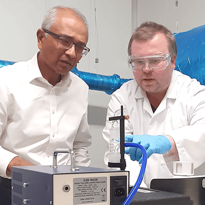 Dr Arnab Basu, CEO, and Dr David Tupman, Senior Scientist, looking at new technology in bioaerosol evaluation chamber